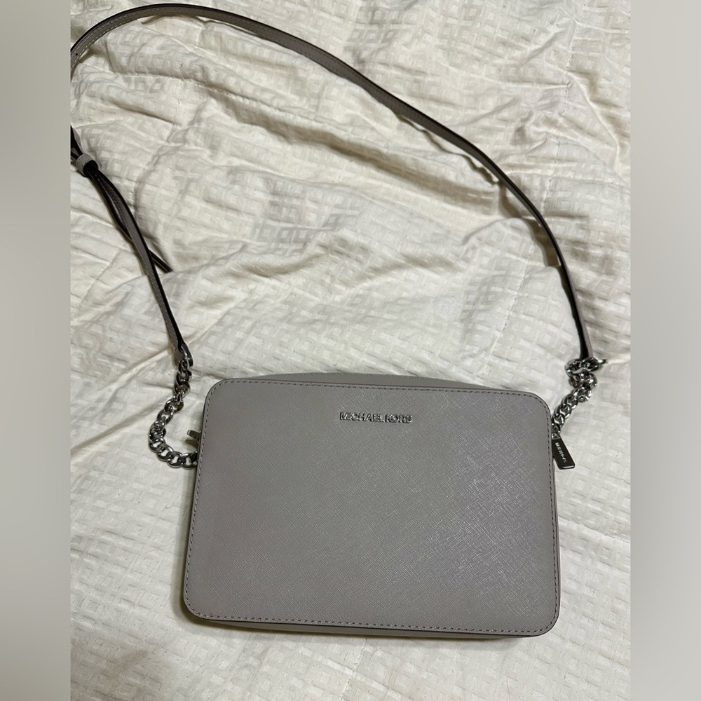 Grey Michael Kors purse, medium size, single zipper, two side compartments